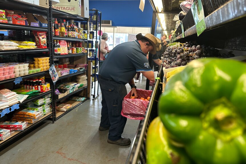 A man shopping for fresh fruit 