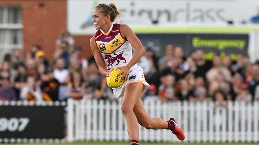 Kaitlyn Ashmore of the Lions controls the ball against Adelaide in AFLW round 1, 2018.