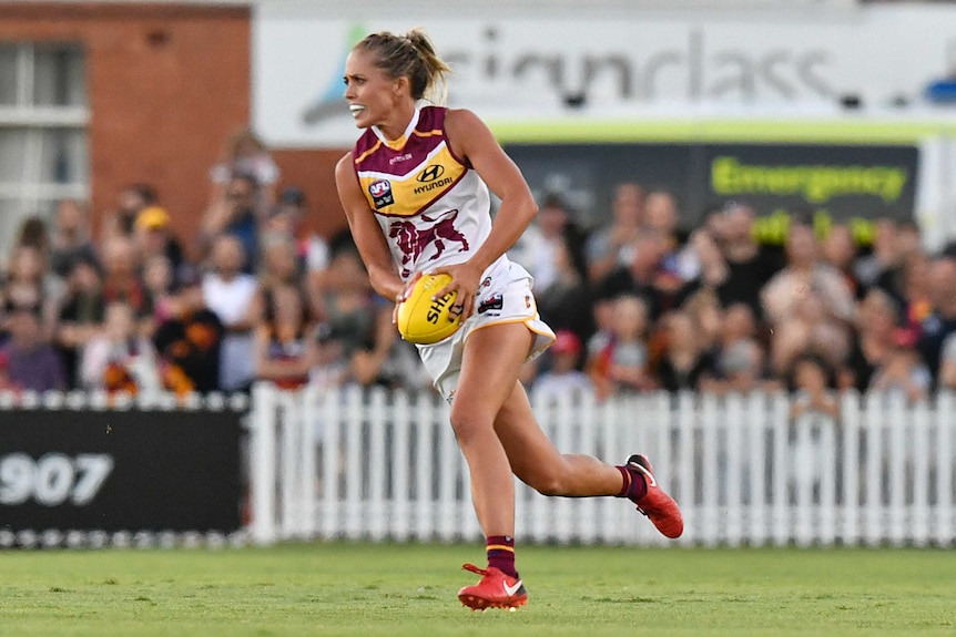 Kaitlyn Ashmore of the Lions controls the ball against Adelaide in AFLW round 1, 2018.