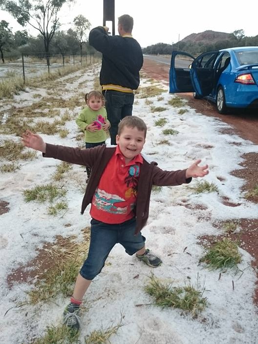 Family fun in the hail at Alice Springs