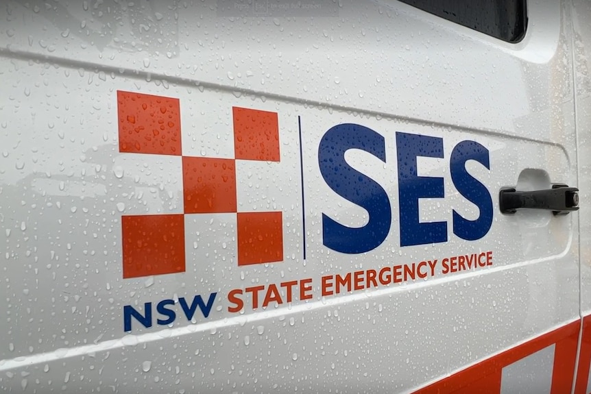 A close-up photo of a car door with a sticker that reads 'NSW State Emergency Service'.