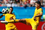 Tom Rogic (R) rarely enjoyed possession in the Soceroos' loss to France.