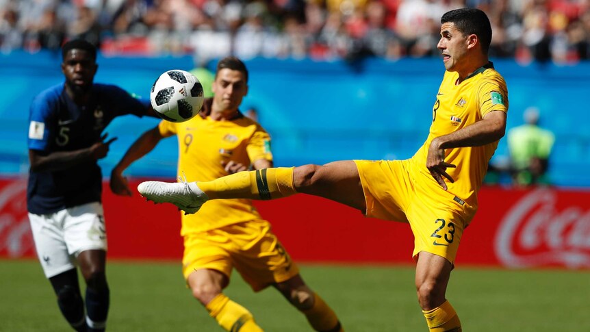 Tom Rogic (R) rarely enjoyed possession in the Soceroos' loss to France.