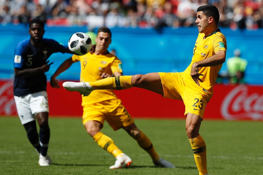 Tom Rogic (R) rarely enjoyed possession in the Soceroos' loss to France.