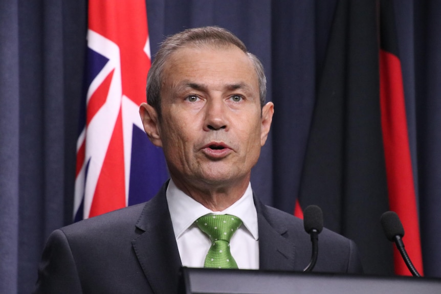 Roger Cook at a press conference
