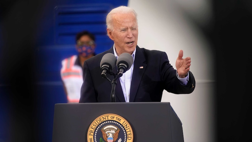 US President Joe Biden gestures as he speaks