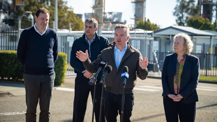 Chris Bowen and Sharon Claydon join business leaders from Origin Energy and Orica in front of factory