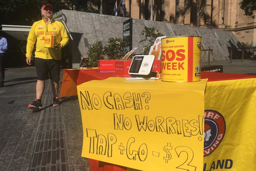SLSQ volunteer in King George Square collecting donations for SOS Week