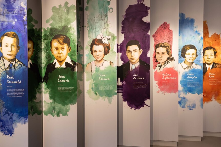 A Holocaust museum exhibit showing seven children