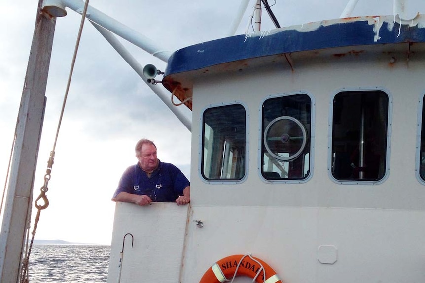 Scallop fisherman John Hammond looks over the deck