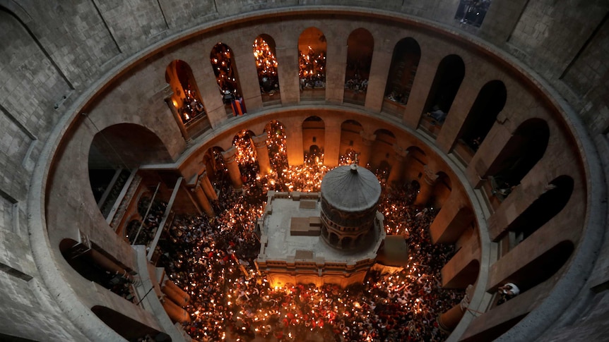 An aerial view shows Worshippers holding candles as they take part in the Holy Fire ceremony in Jerusalem's Old City.