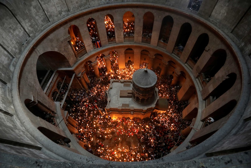 An aerial view shows Worshippers holding candles as they take part in the Holy Fire ceremony in Jerusalem's Old City.