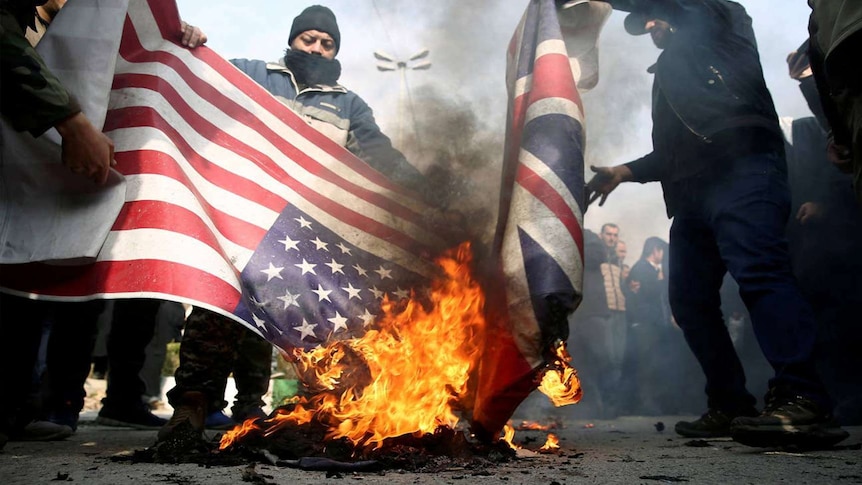 A group set fire to the American and British flags