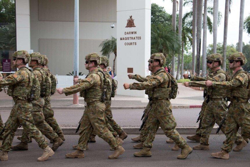 Troops parade through streets of Darwin