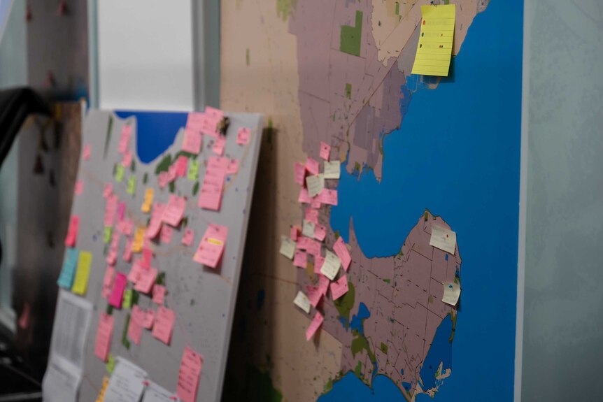 A map with sticky notes stuck to it.