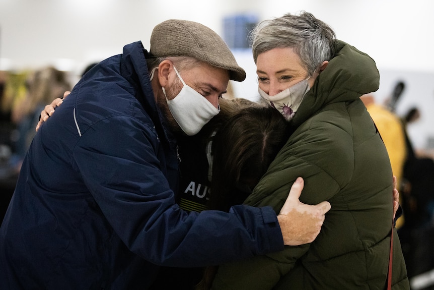 Family hugs at airport WA border reopening