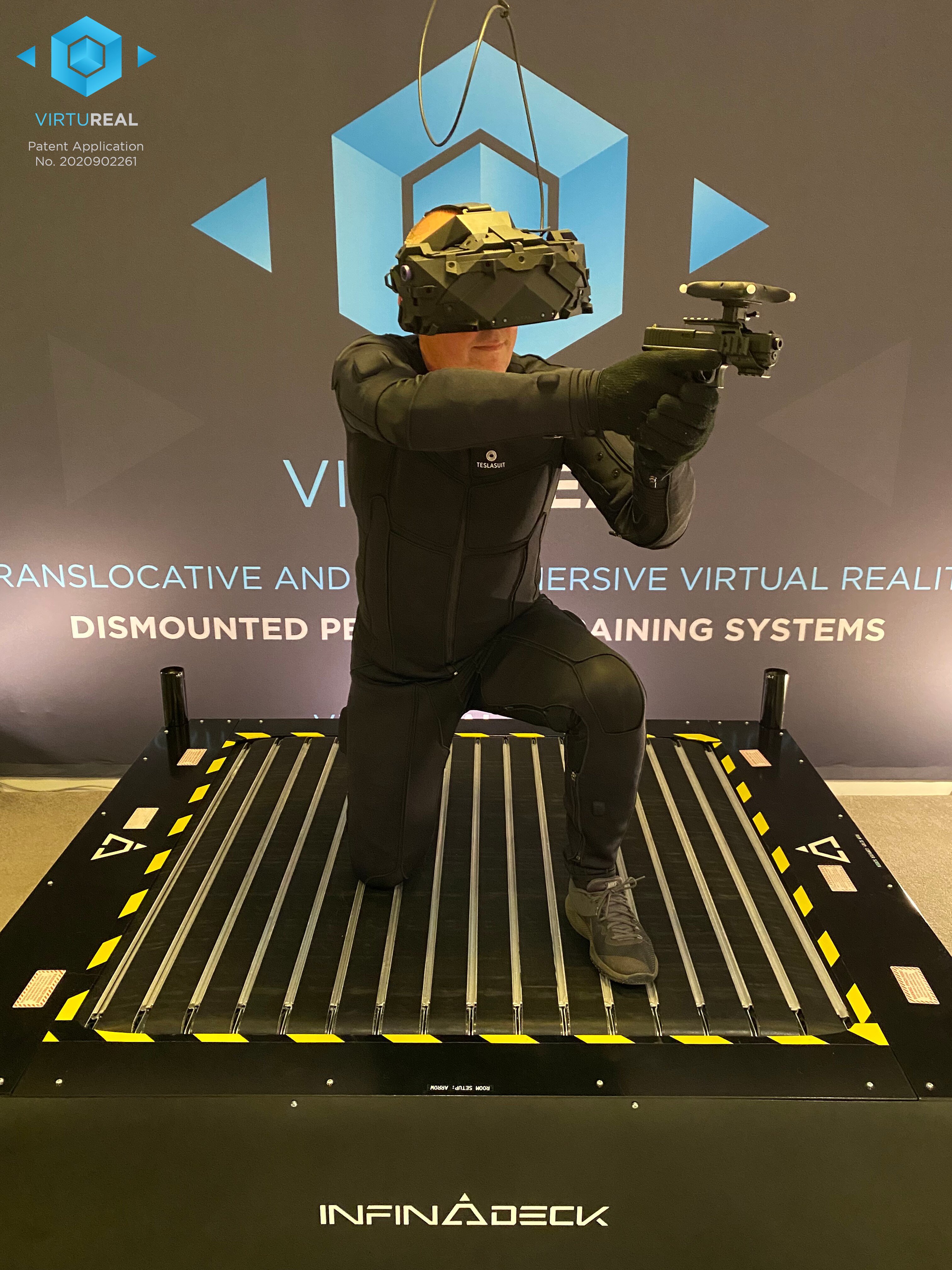 A man wearing a VR headset and a Teslasuit