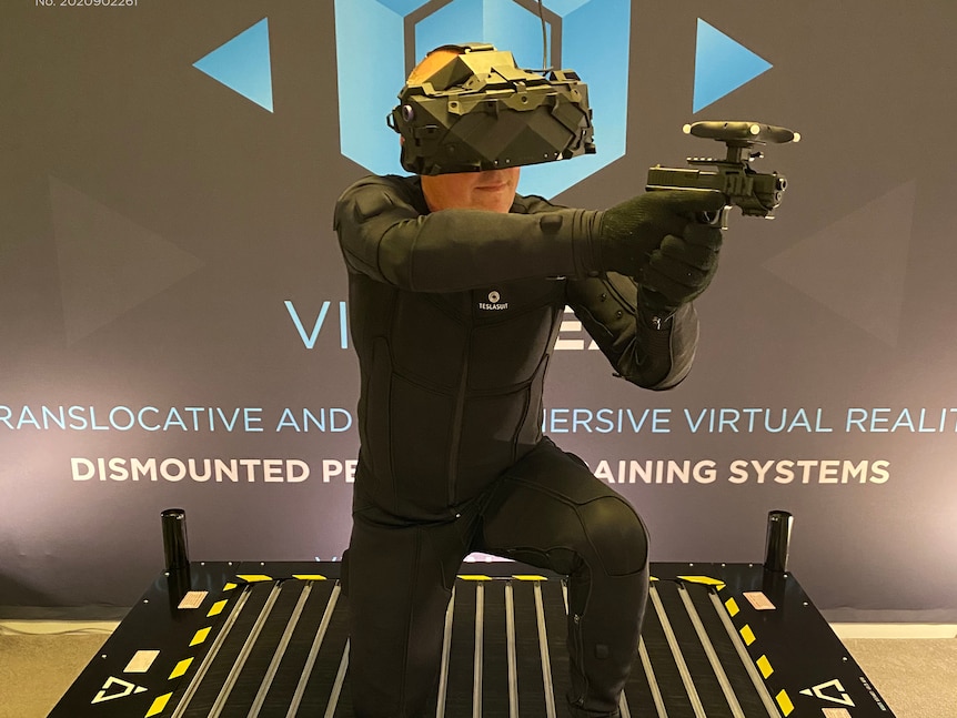 A man wearing a VR headset and a Teslasuit