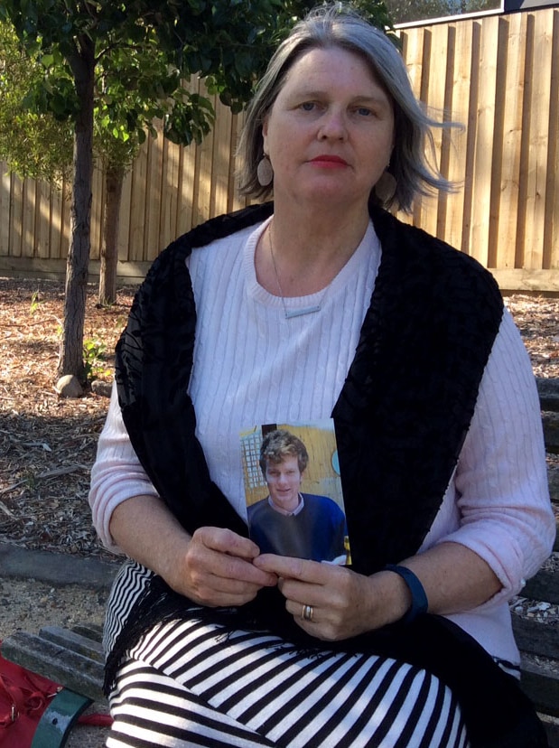 Lisa with photo of her son Elliot who committed suicide