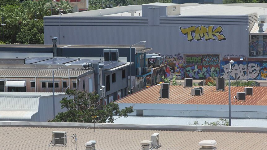 A photo of some air-conditioning units on hot tin roofs in Darwin city.