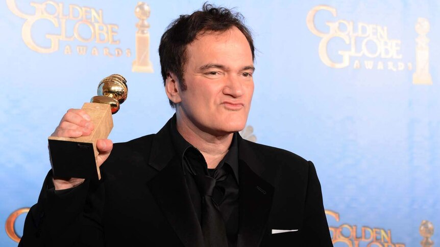 Quentin Tarantino shows off his Golden Globe