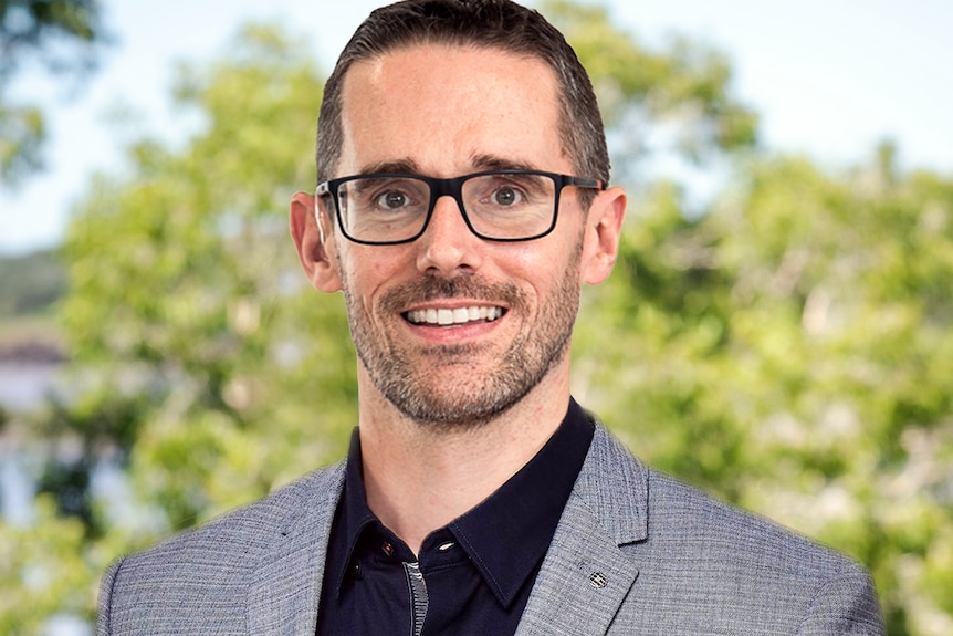 Headshot of Brent smiling.