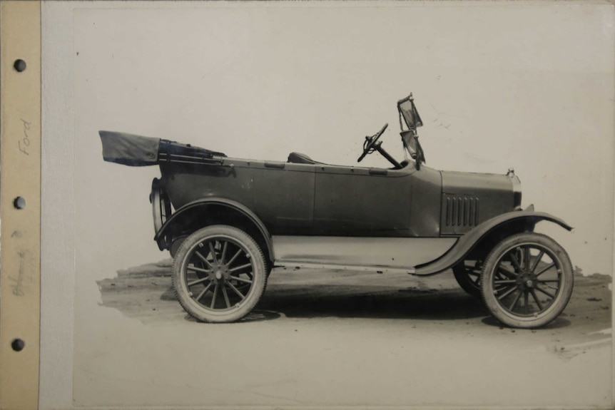 Historic black and white photo of a Ford.