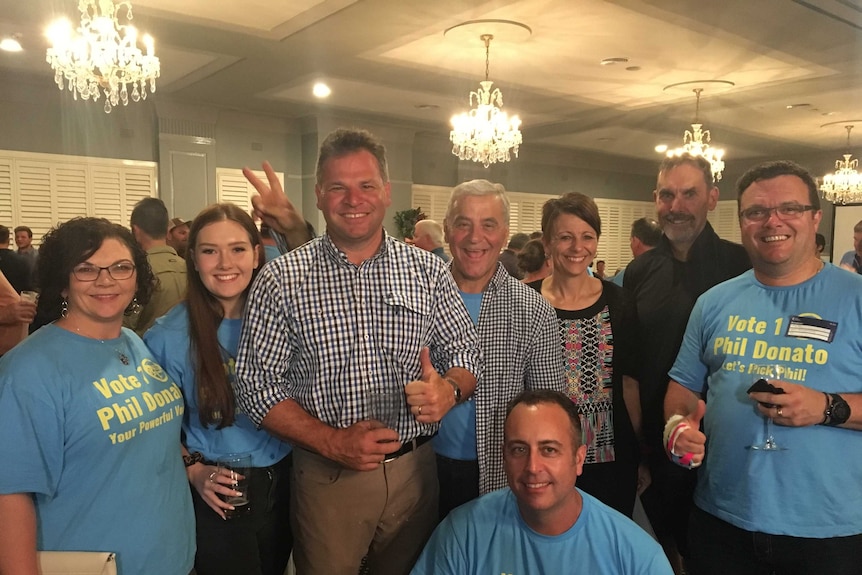 A group of happy people in the aftermath of an election win.