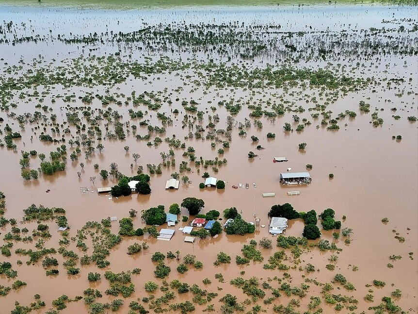 An aerial shot of a flooded outback property