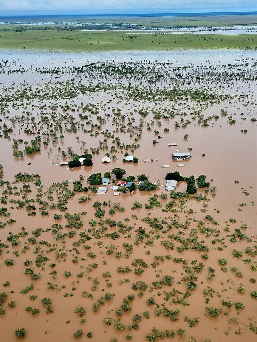 An aerial shot of a flooded outback property