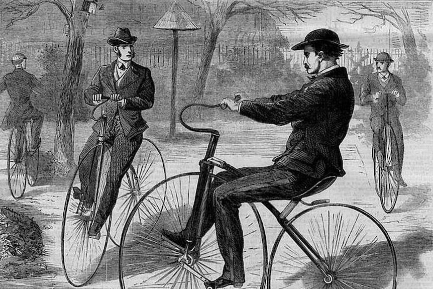 Drawing or lithograph from the 1800s, showing men in suits riding around on velocipedes