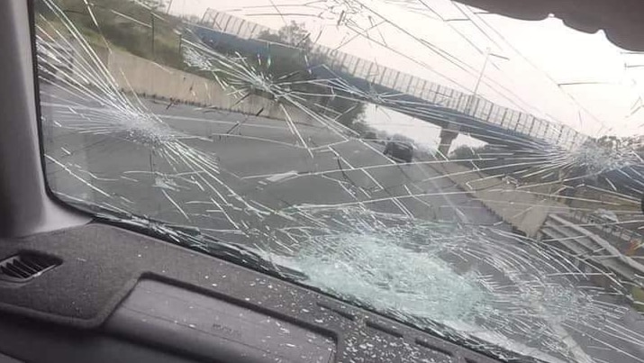 A badly smashed car windscreen.