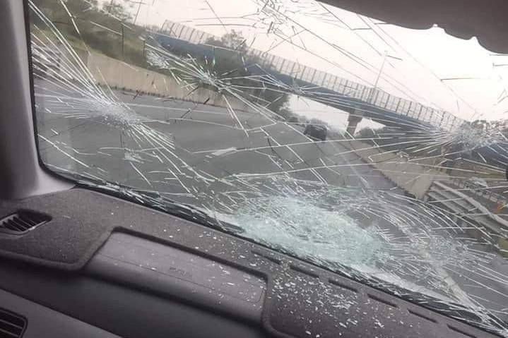 A badly smashed car windscreen.