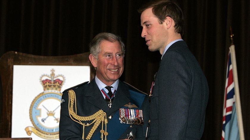 Prince William (right) is handed his RAF wings by father Prince Charles