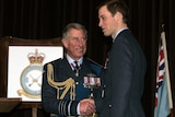 Prince William (right) is handed his RAF wings by father Prince Charles