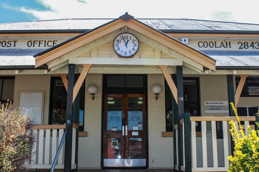 Front of the heritage timber Post office building of Coolah with clock