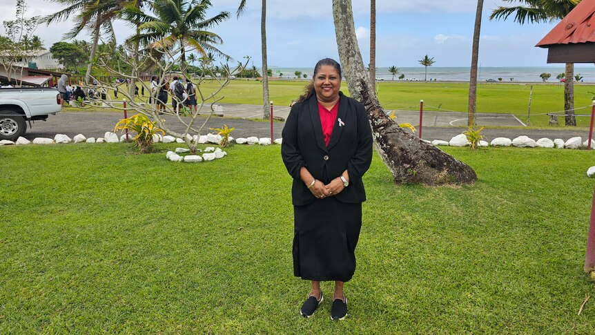 Sacred Heart Cathedral College Principal, Praveen Chand standing in front of the school located next to the Nasese foreshore, a red zone area for