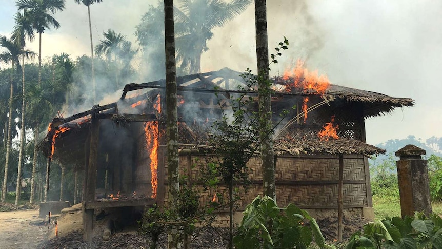 A house is engulfed in flames.