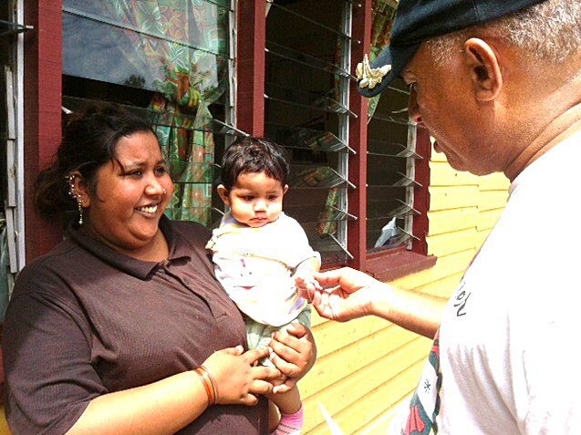 Frank Bainimarama visits one of the flood evacuation centres.