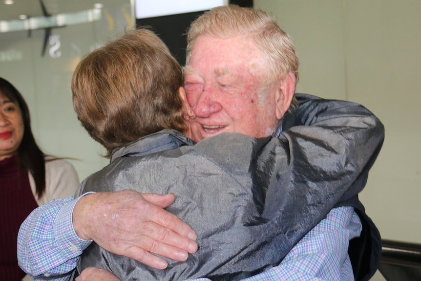 Australian Nun Sister Patricia Fox embraces her brother Kevin in the arrivals area at Melbourne Airport