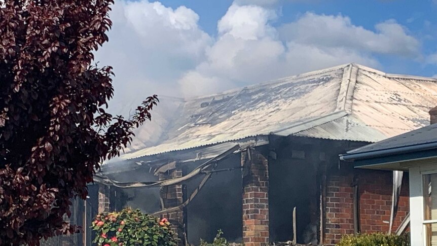 Smoke comes out of a house fire at Newnham in Launceston.