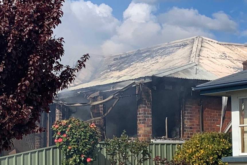 Smoke comes out of a house fire at Newnham in Launceston.
