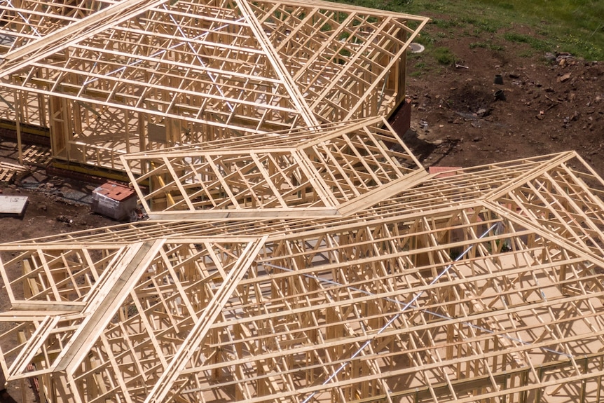 Aerial photo of housing frame construction at building site.