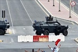Protesters stand back from a road block close to Pearl Square, Bahrain (AFP/Getty)