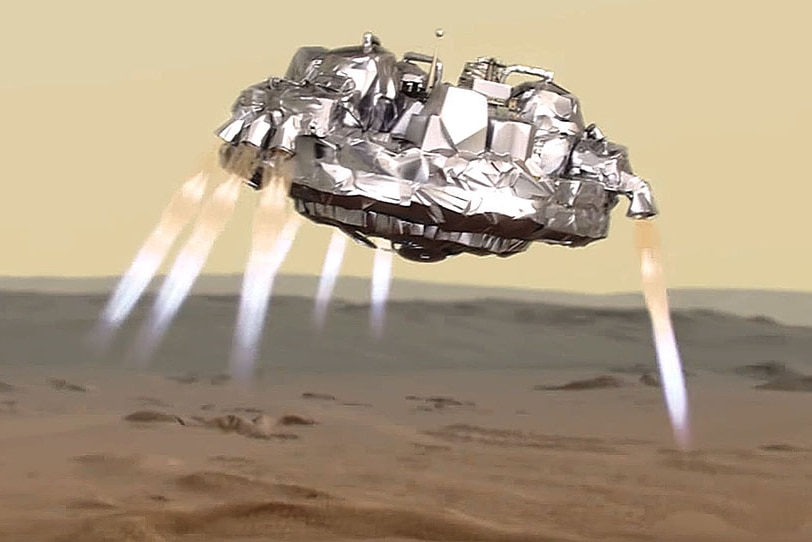 An artist's view shows Schiaparelli using its thrusters to make a soft landing on Mars