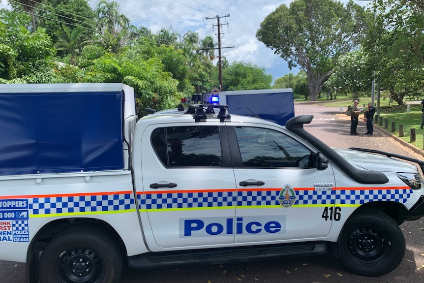 A police car blocks a road near a crime scene in the Darwin suburb of Jingili.
