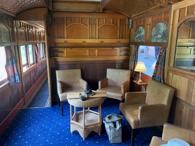 an old carriage is restored with a dining area