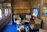 an old carriage is restored with a dining area