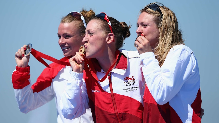 First gold ... Jodie Stimpson (C) celebrates alongside Kirsten Sweetland (L) and Vicky Holland