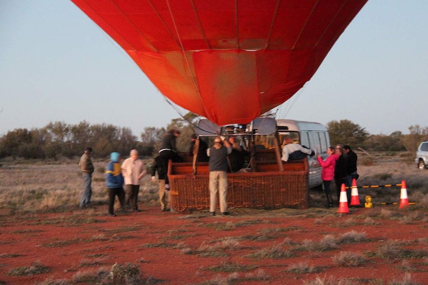 Passengers boarding a hot air balloon ride in Alice Spring.